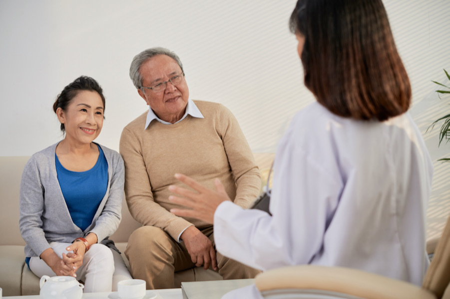 Dietitian visiting with elderly couple
