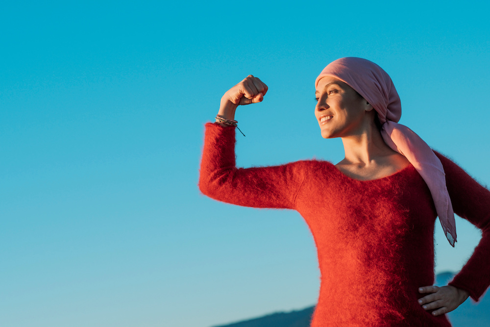 Woman showing her fist of power against cancer_Dietitians On Demand