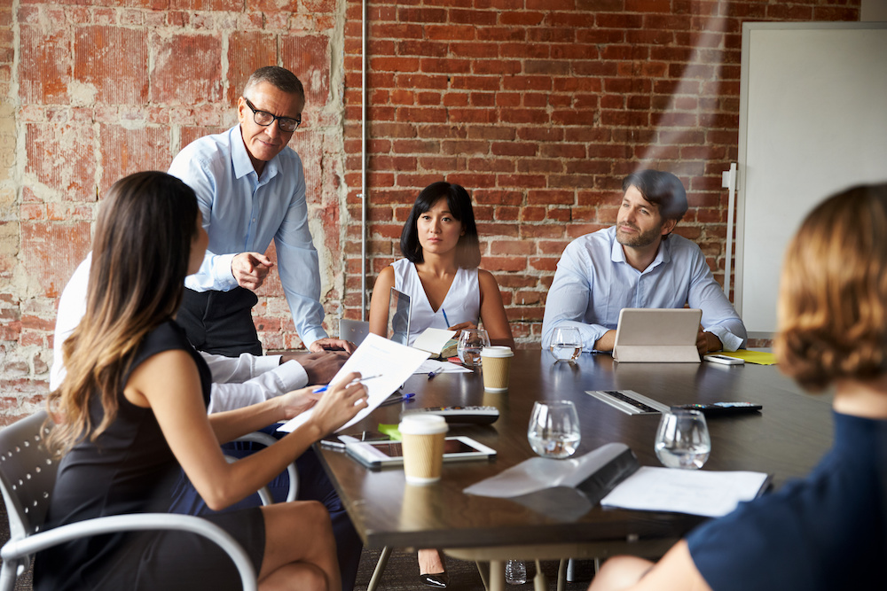 A team at work collaborating in a meeting room